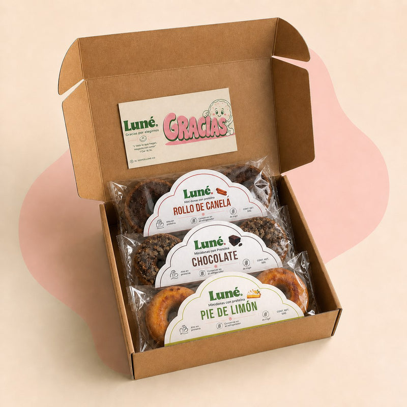 Caja Luné abierta con las tres bolsas y la tarjeta de agradecimiento